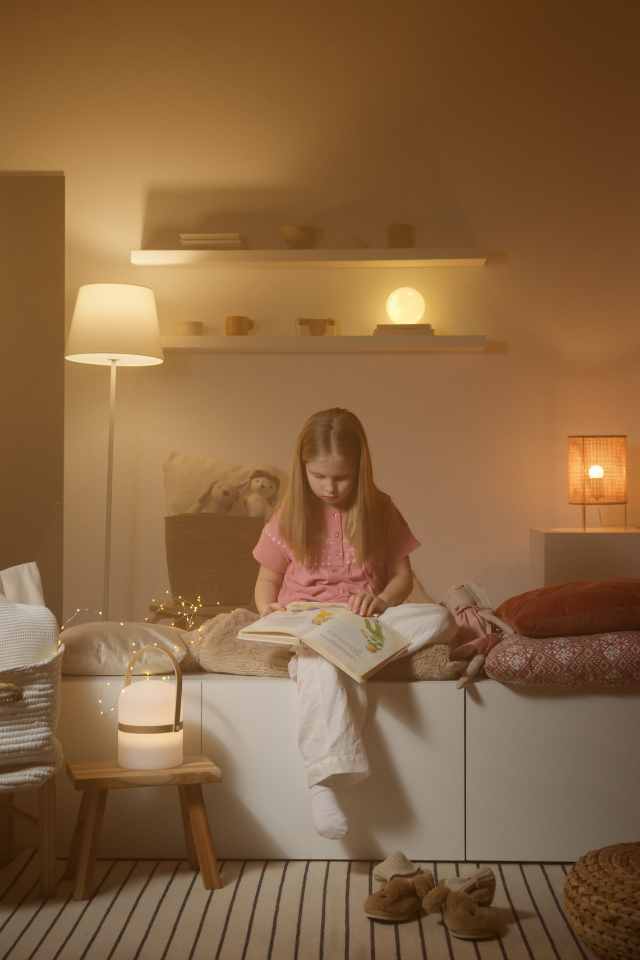 warm lighting in living room with child reading